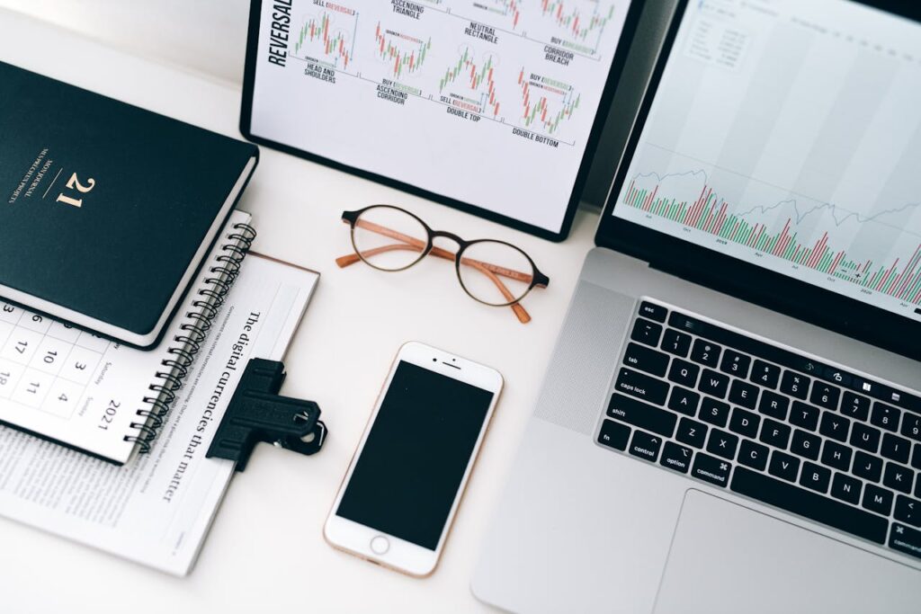 Laptop Beside Eyeglasses and Smartphone